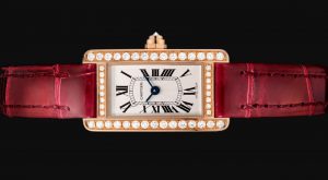 The 18k rose gold fake Cartier watch has a red strap.